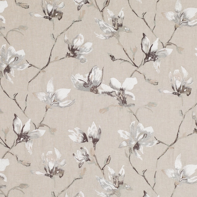 Pale greige embroidered fabric with white blossoms and charcoal branching stems