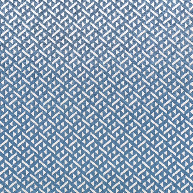 Muted blue woven fabric with crisp ivory angular zigzag marks in a small-scale pattern