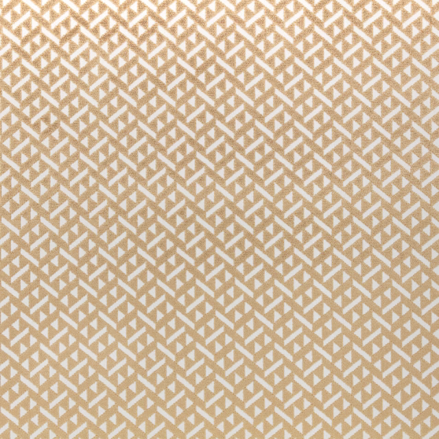Warm beige and cream woven fabric with a small angular geometric repeat