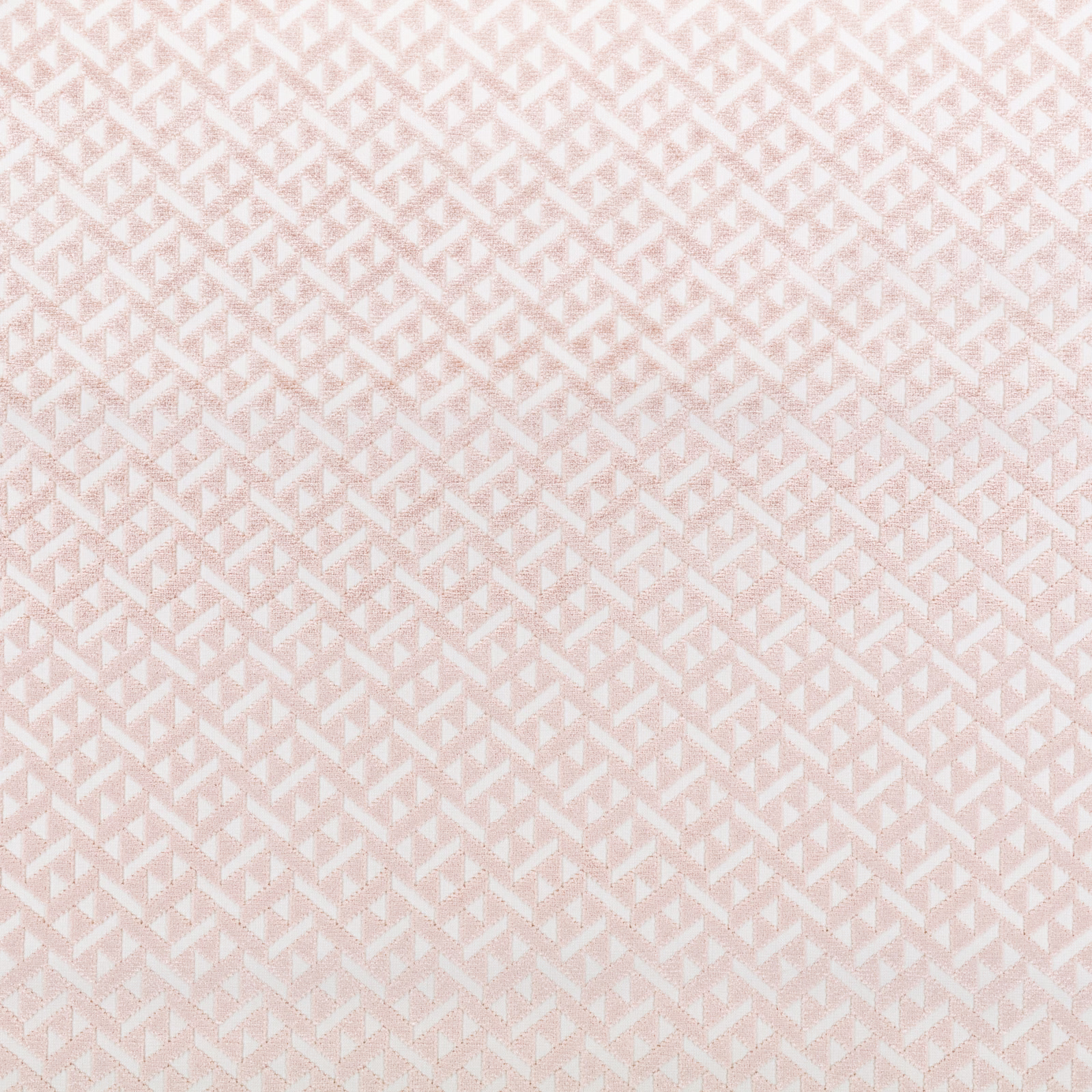 Soft blush pink fabric with tiny ivory stepped geometric motifs and fine woven texture