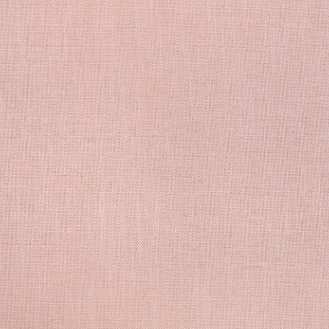 Close-up of fine rose quartz pink plain-weave fabric with subtle crosshatch texture