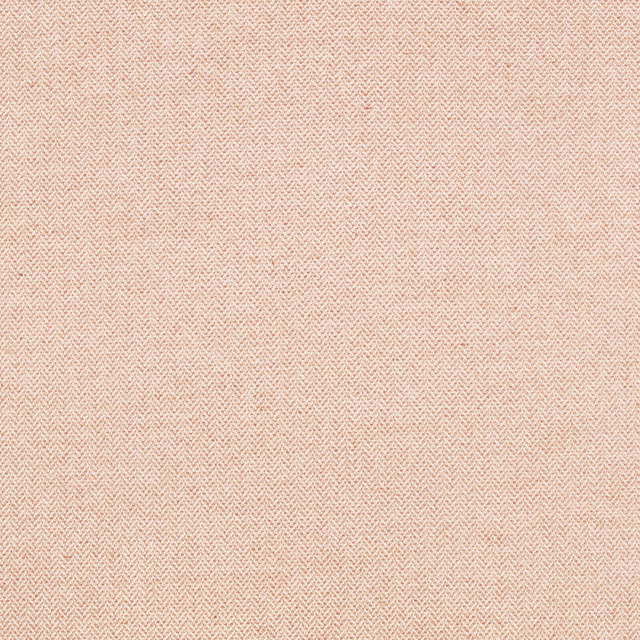 Pale conch peach-pink fabric with a fine, tactile herringbone weave