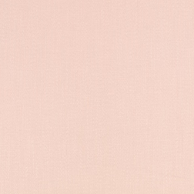 Pale rose quartz pink fabric with a fine, subtly textured plain weave