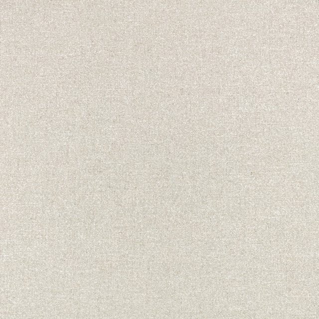 Close-up of warm oat-beige fabric with a fine, subtly flecked woven texture