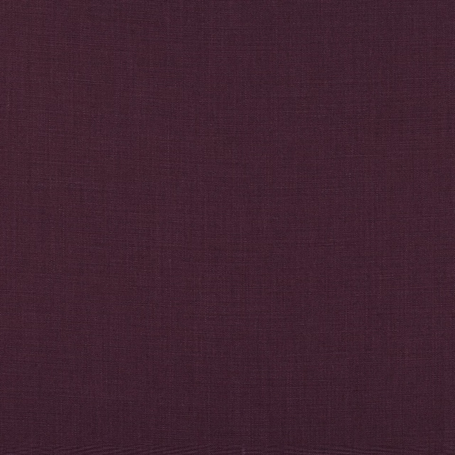 Close-up of deep cassis plum fabric showing a fine crosshatched woven texture