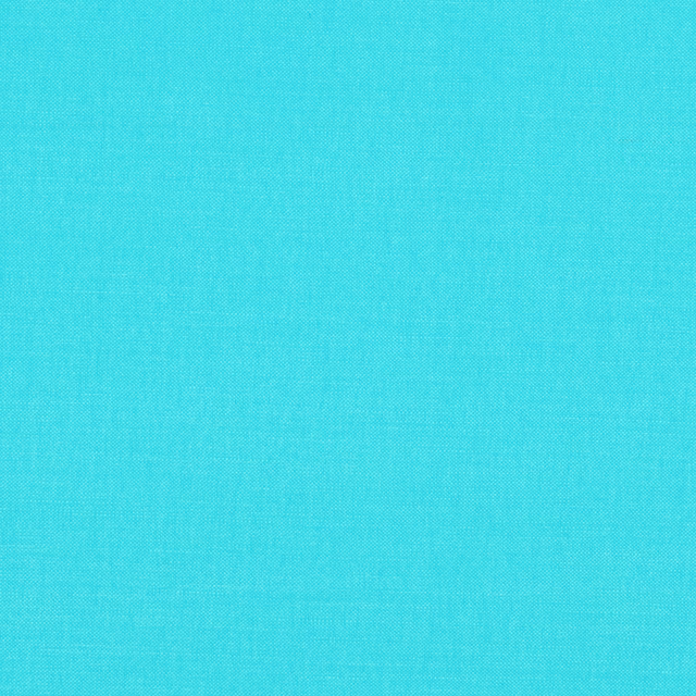 Close-up of bright turquoise Bermuda fabric with a fine, even woven texture
