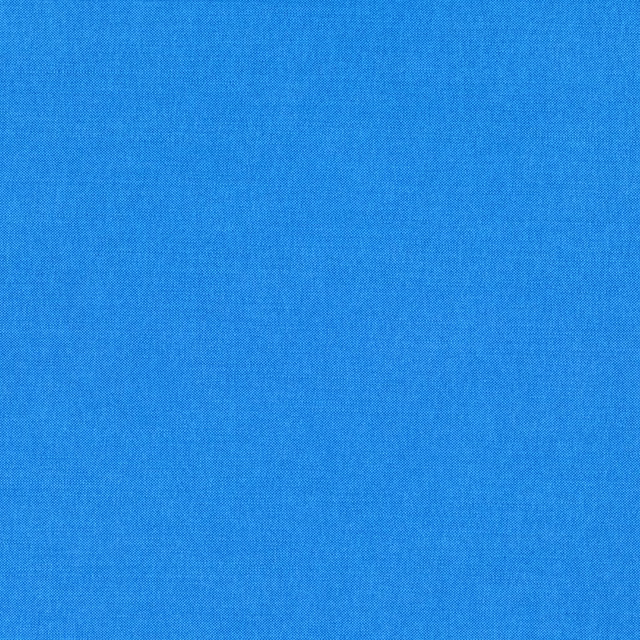 Close-up of clear Copenhagen blue fabric with a fine, even woven texture