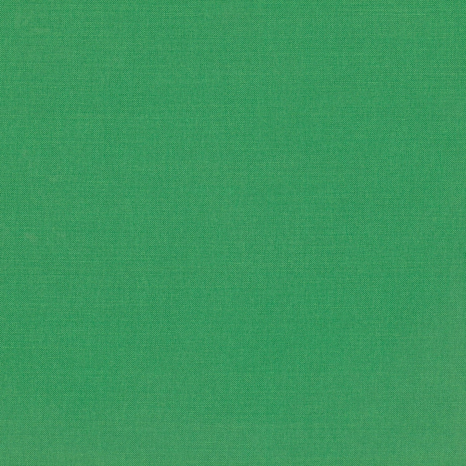 Close-up of saturated emerald green fabric with a fine, even woven texture