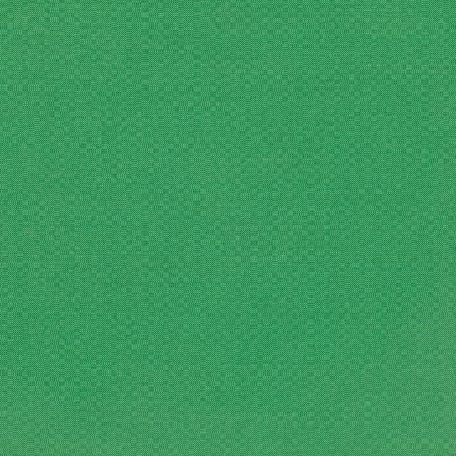 Close-up of saturated emerald green fabric with a fine, even woven texture