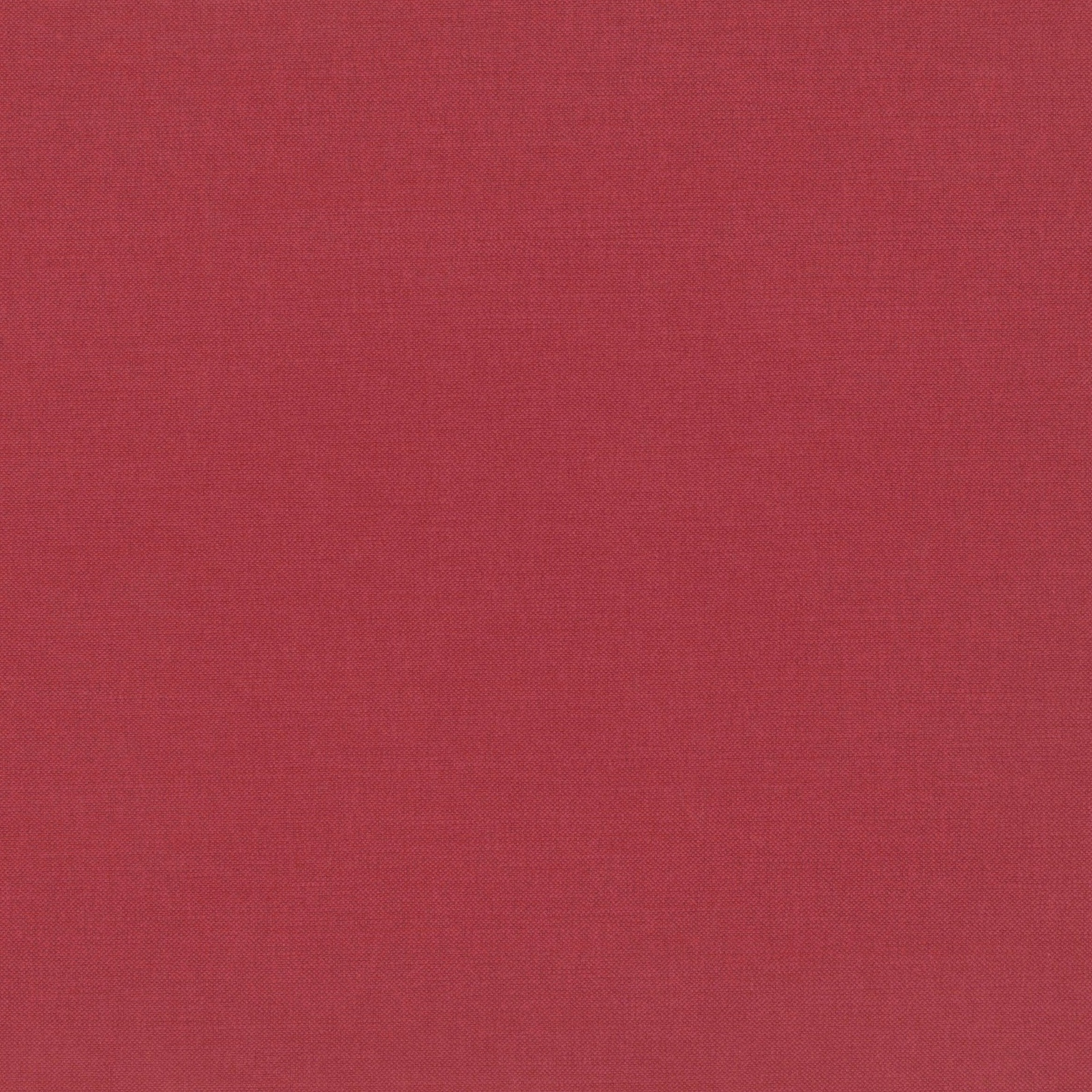 Close-up of warm muted red Linara fabric with a fine woven texture