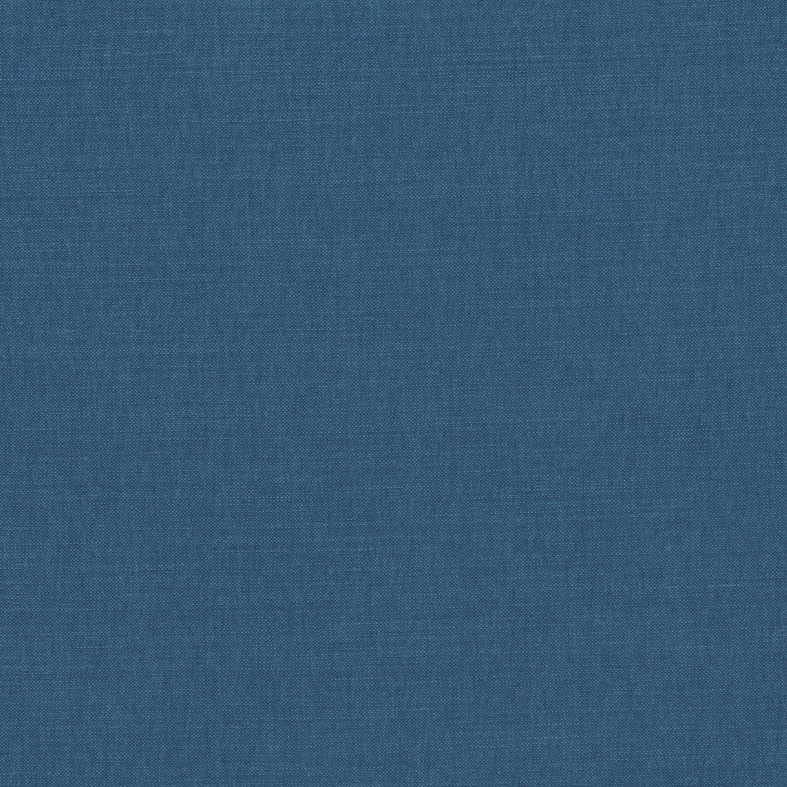 Close-up of muted indigo blue fabric showing a fine, subtly varied plain weave