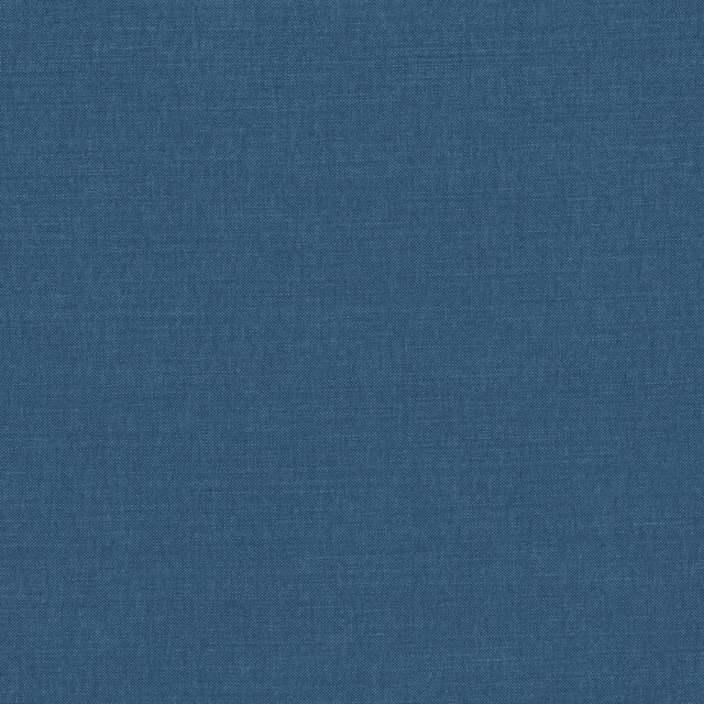 Close-up of muted indigo blue fabric showing a fine, subtly varied plain weave