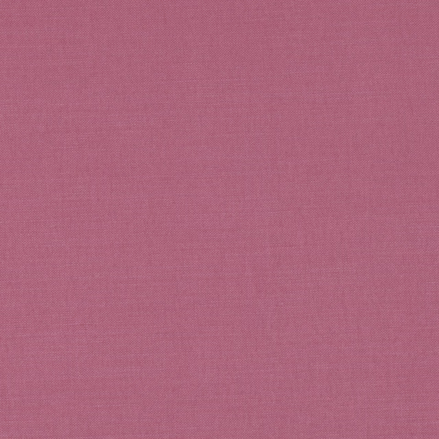 Muted dusty rose-pink plain weave fabric with a fine, even woven texture