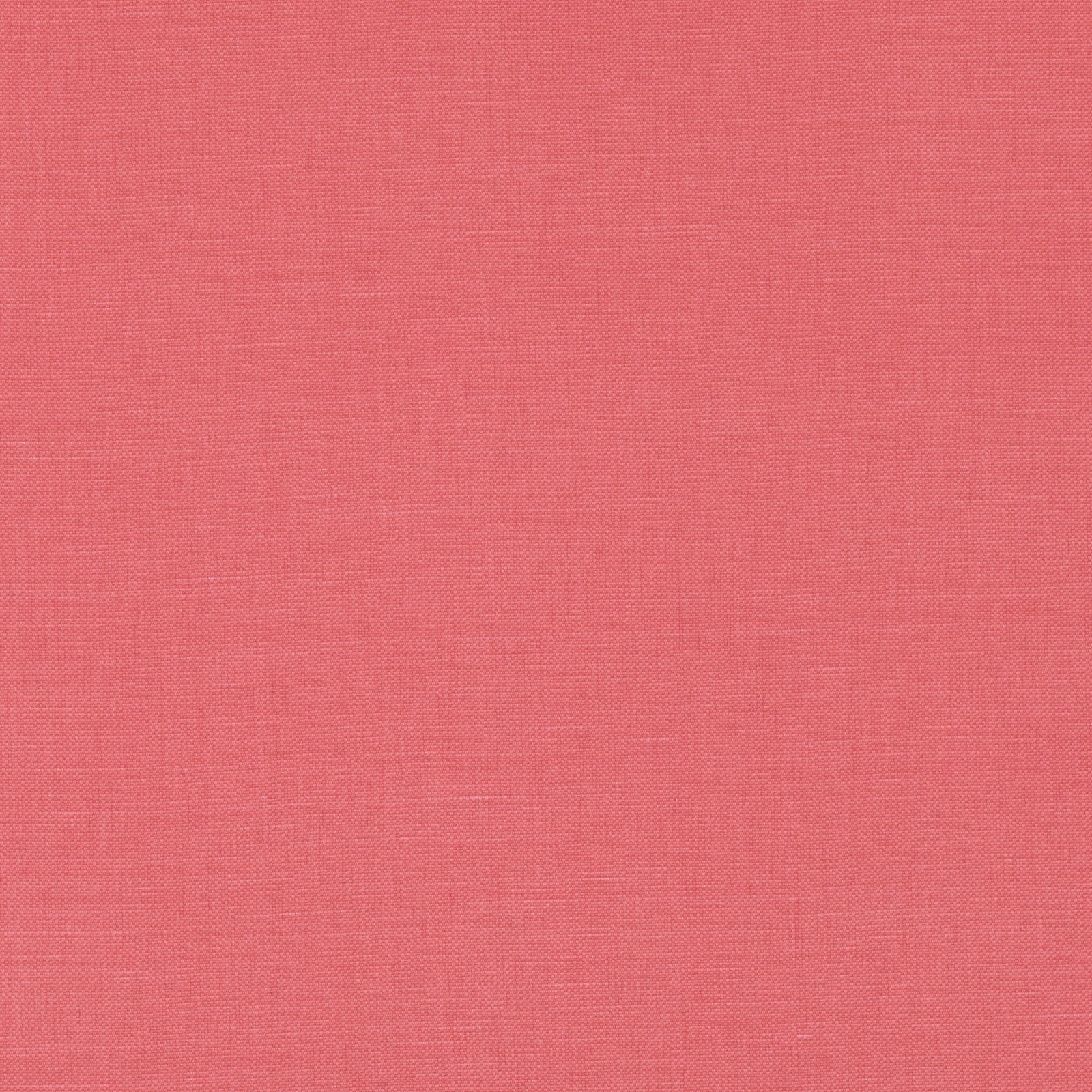 Close-up of warm coral-red plain weave with a fine, softly mottled texture