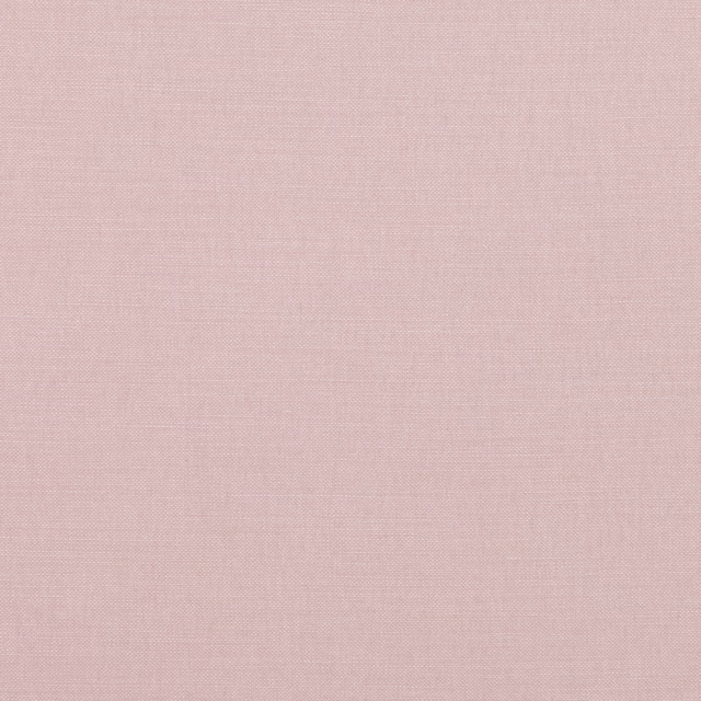 Close-up of muted dusty rose fabric with a fine, softly textured plain weave