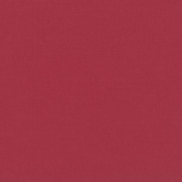 Close-up of ruby-red plain weave showing fine, even textile texture