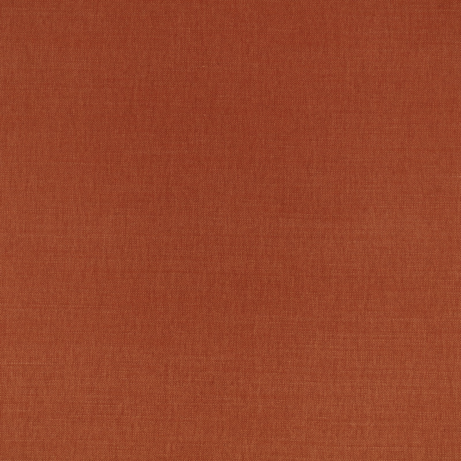 Close-up of warm russet terracotta fabric with a fine, even woven texture