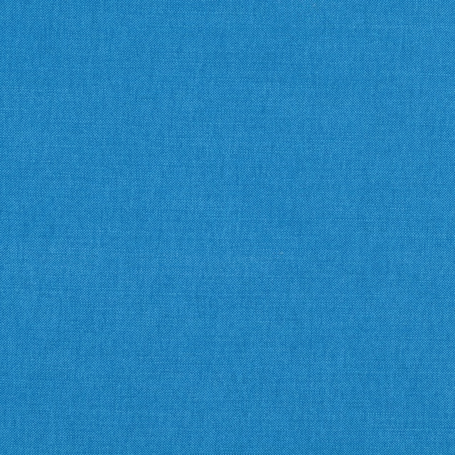 Close-up of vivid ocean-blue fabric with a fine, subtly tonal woven texture