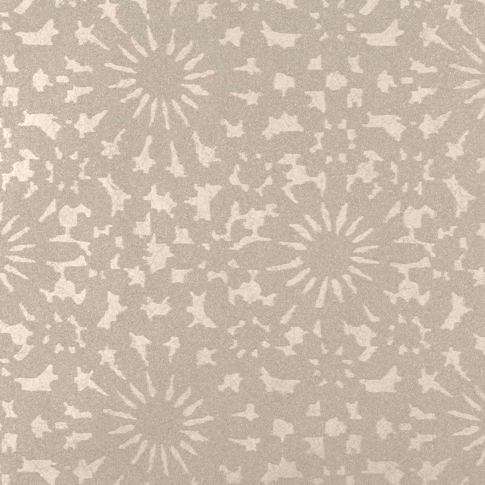 Greige taupe wallpaper with ivory sunburst medallions and scattered organic flecks