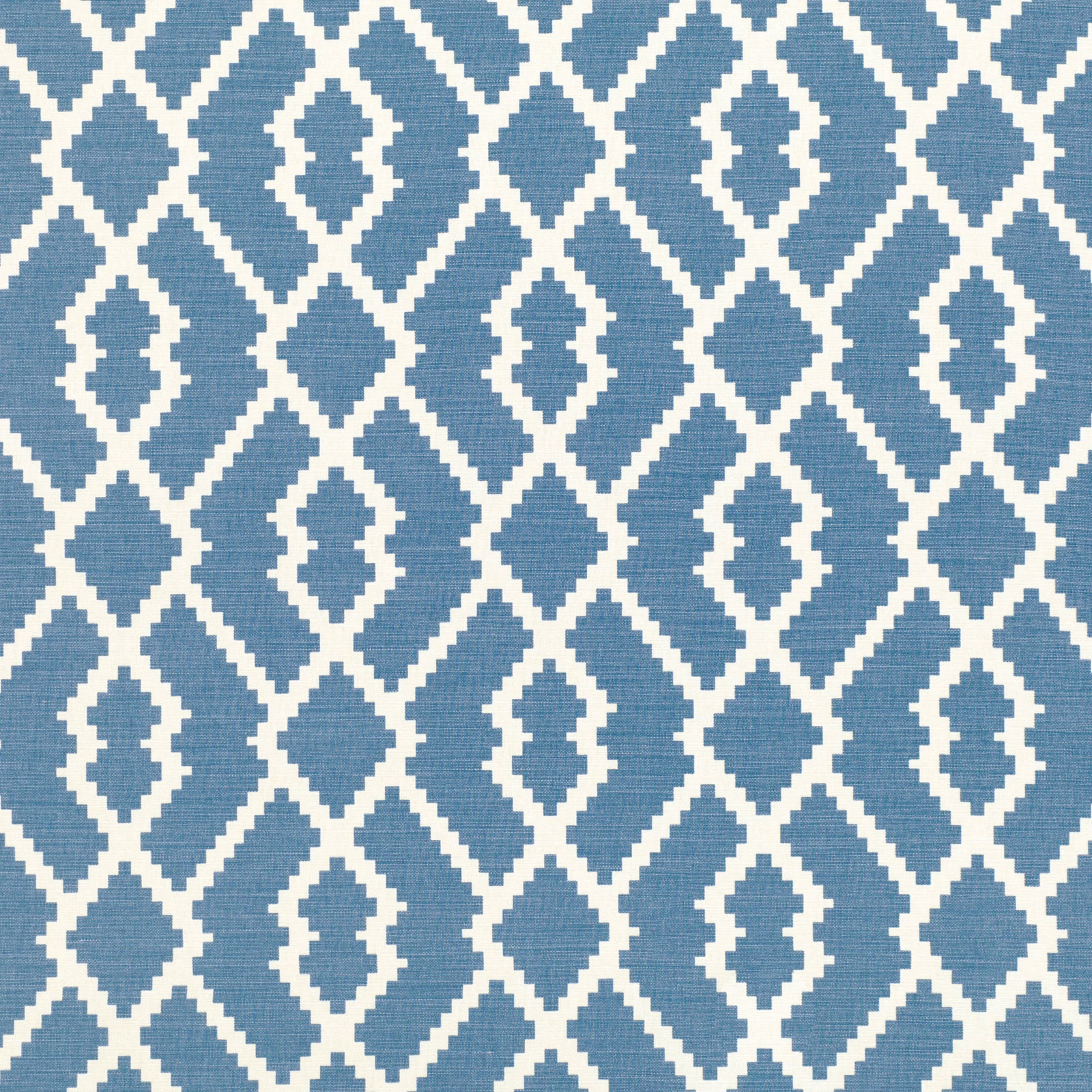 Muted denim-blue woven fabric with ivory diamonds and repeating stepped lozenge motifs