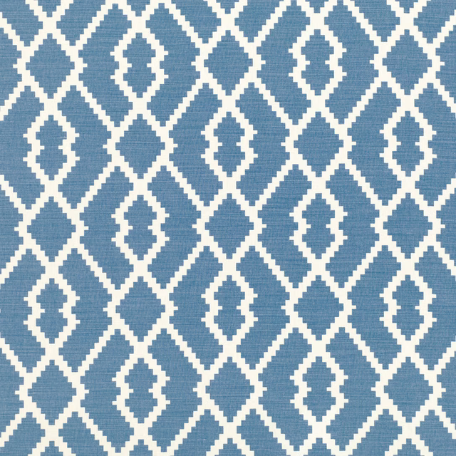 Muted denim-blue woven fabric with ivory diamonds and repeating stepped lozenge motifs