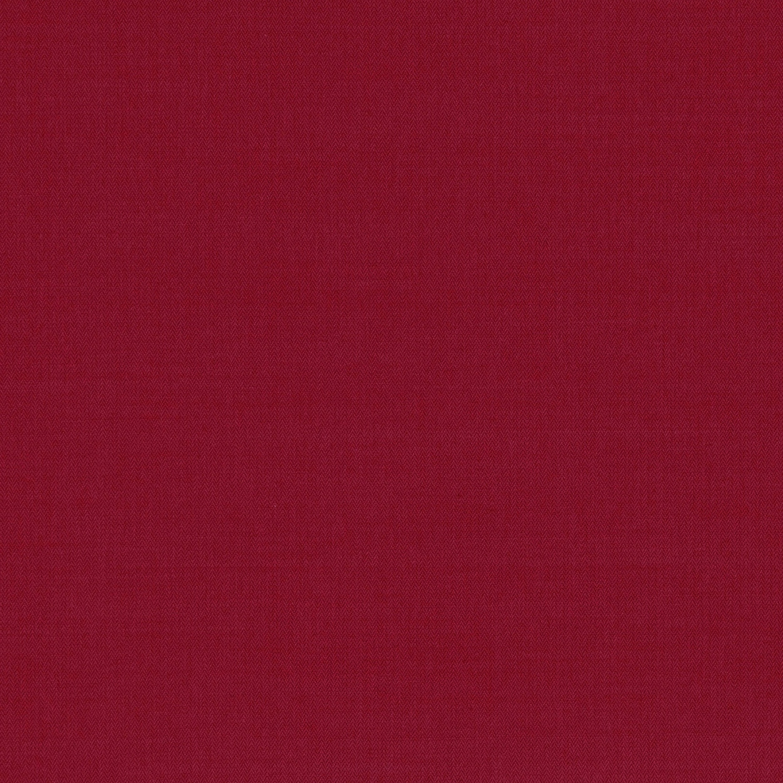 Close-up of deep cranberry-red fabric with a fine, even woven texture