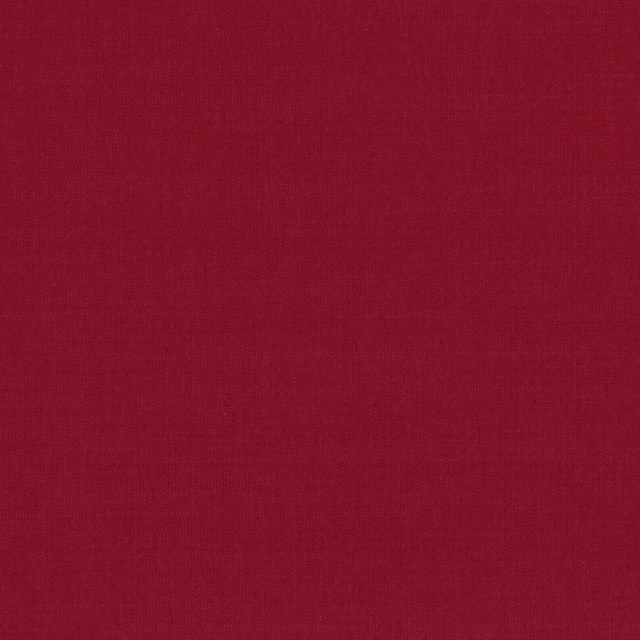 Close-up of deep cranberry-red fabric with a fine, even woven texture