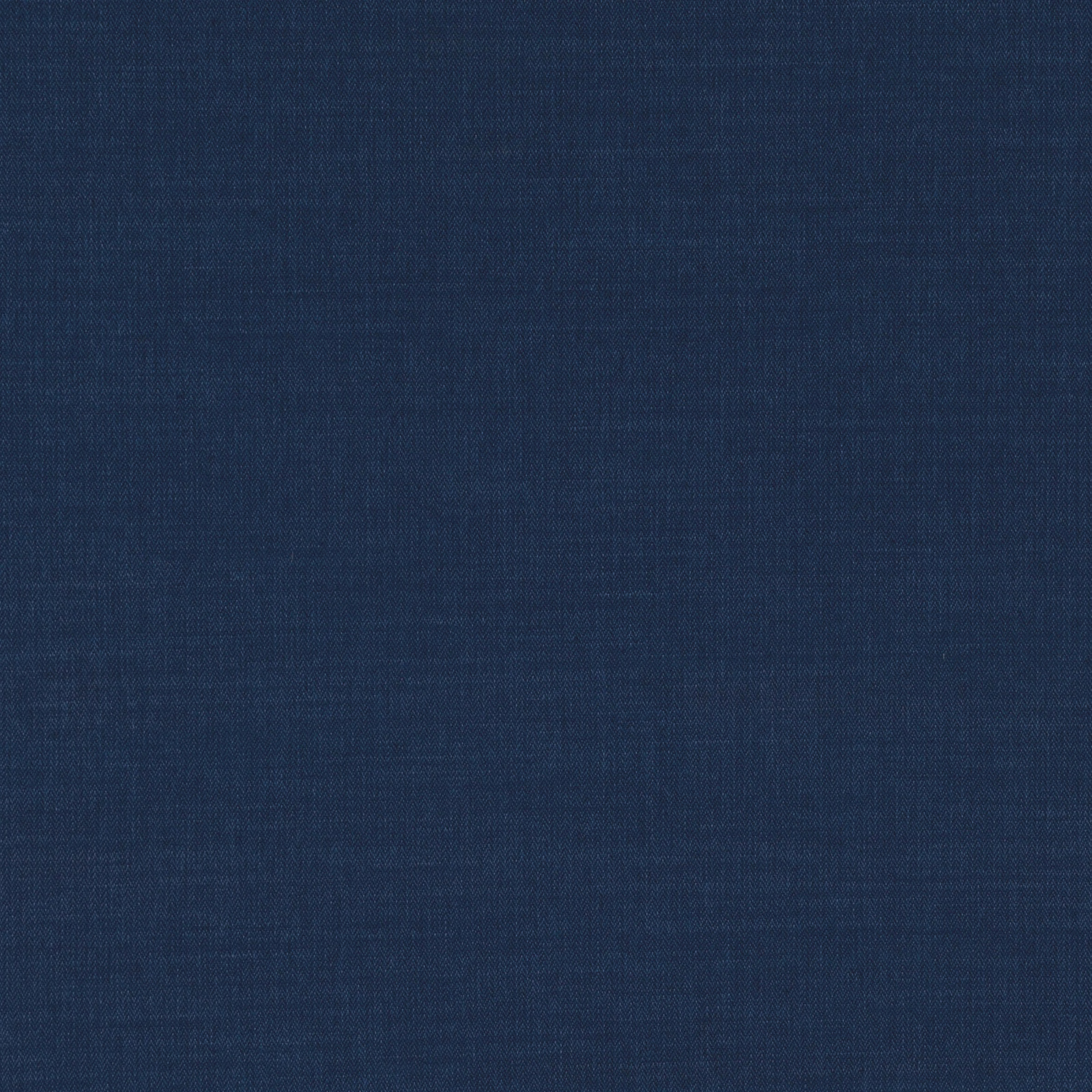 Close-up of deep indigo-blue fabric with a fine, subtly varied woven texture