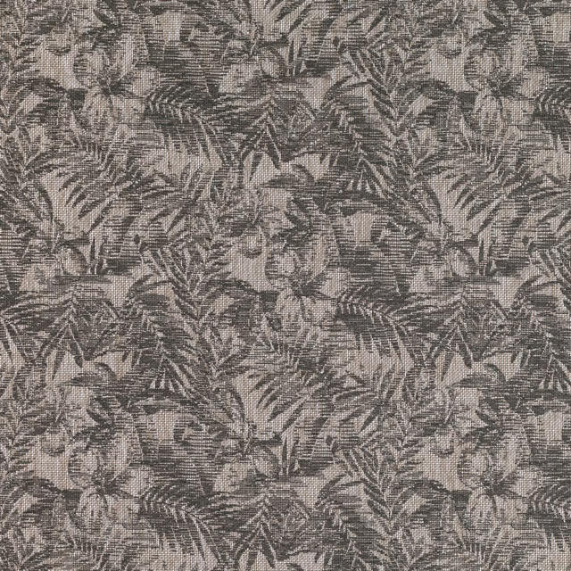 Charcoal grey woven fabric with dense leafy botanical and floral motifs
