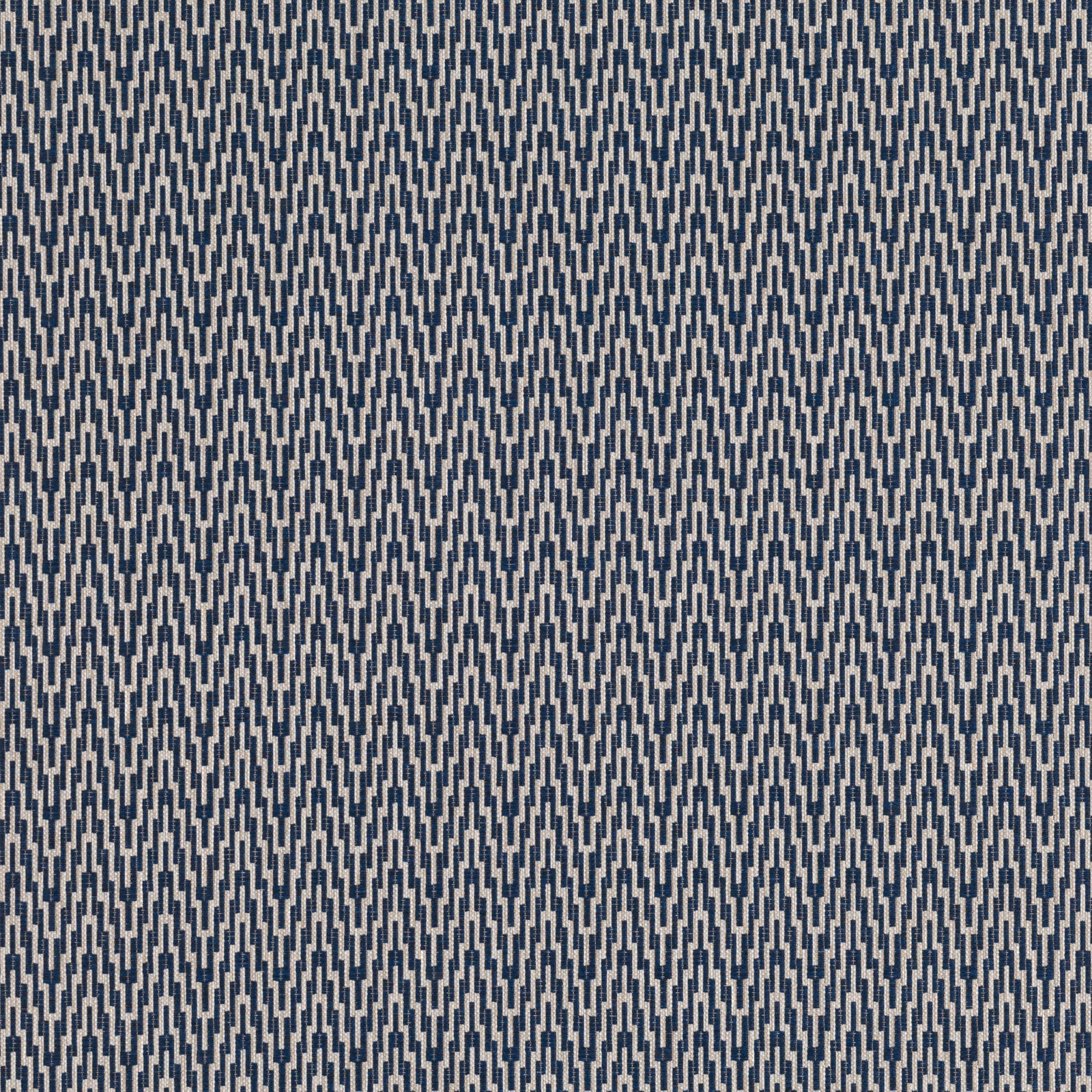 Close-up of cool indigo upholstery fabric with pale grey geometric zigzag weave