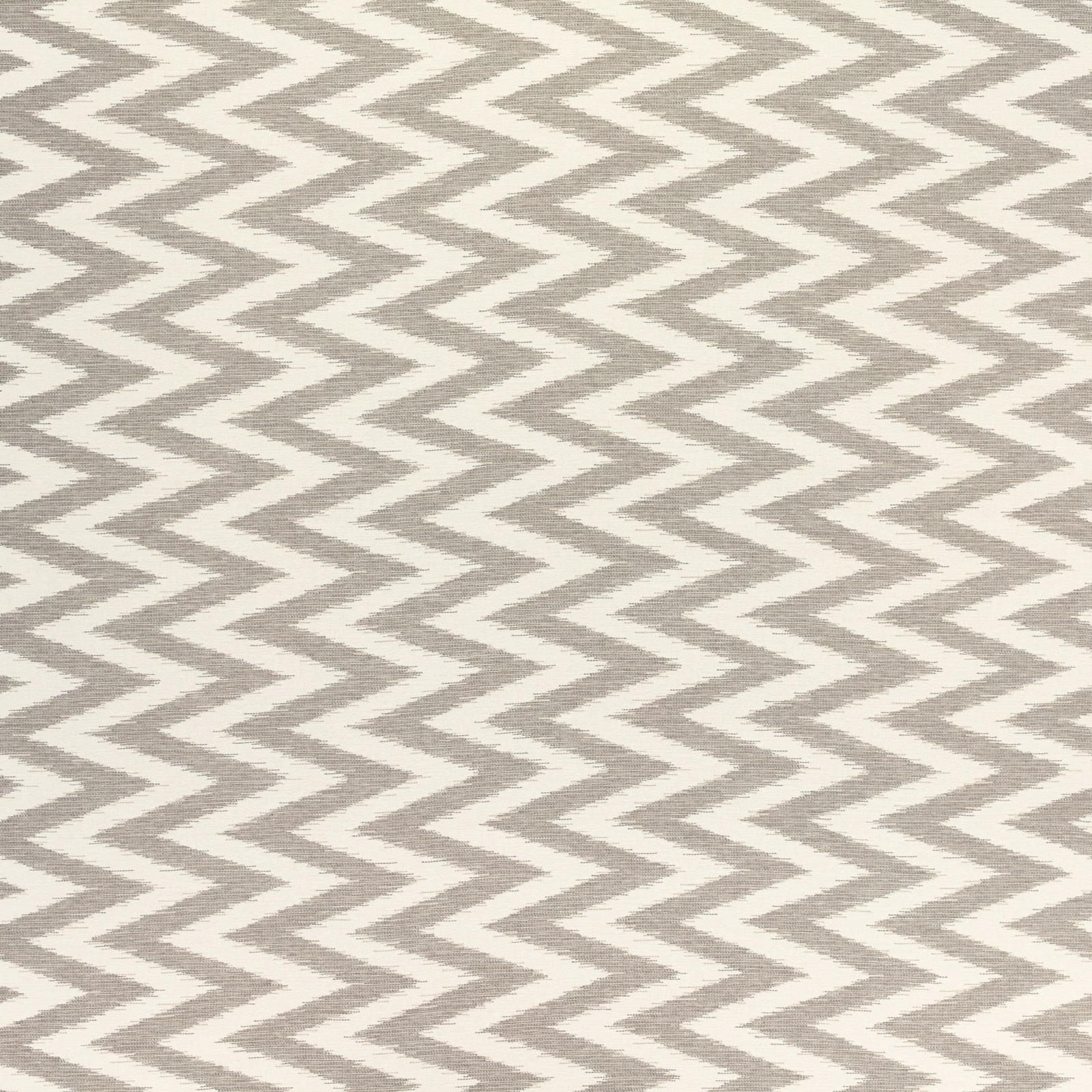 Warm greige and ivory woven fabric with tightly repeated zigzag chevrons