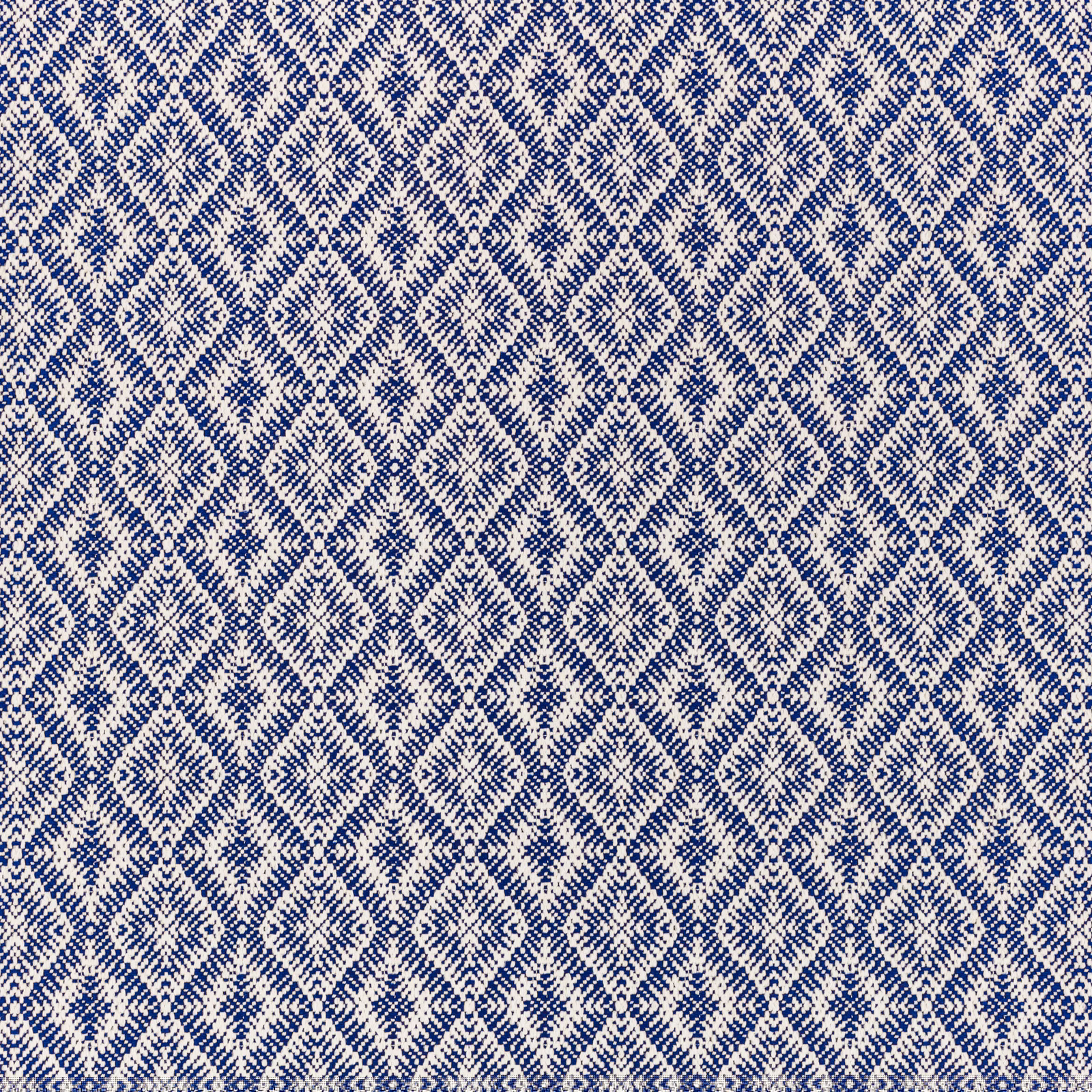 Deep navy and ivory woven fabric with repeating irregular diamond motifs