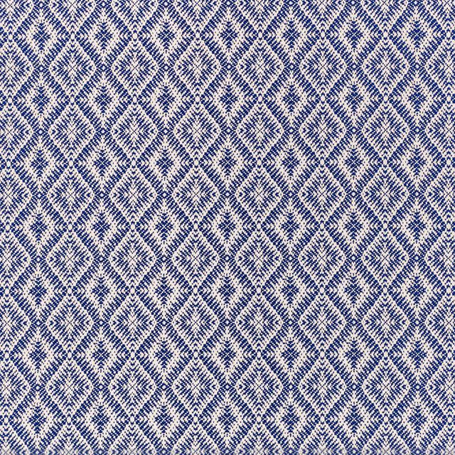 Deep navy and ivory woven fabric with repeating irregular diamond motifs