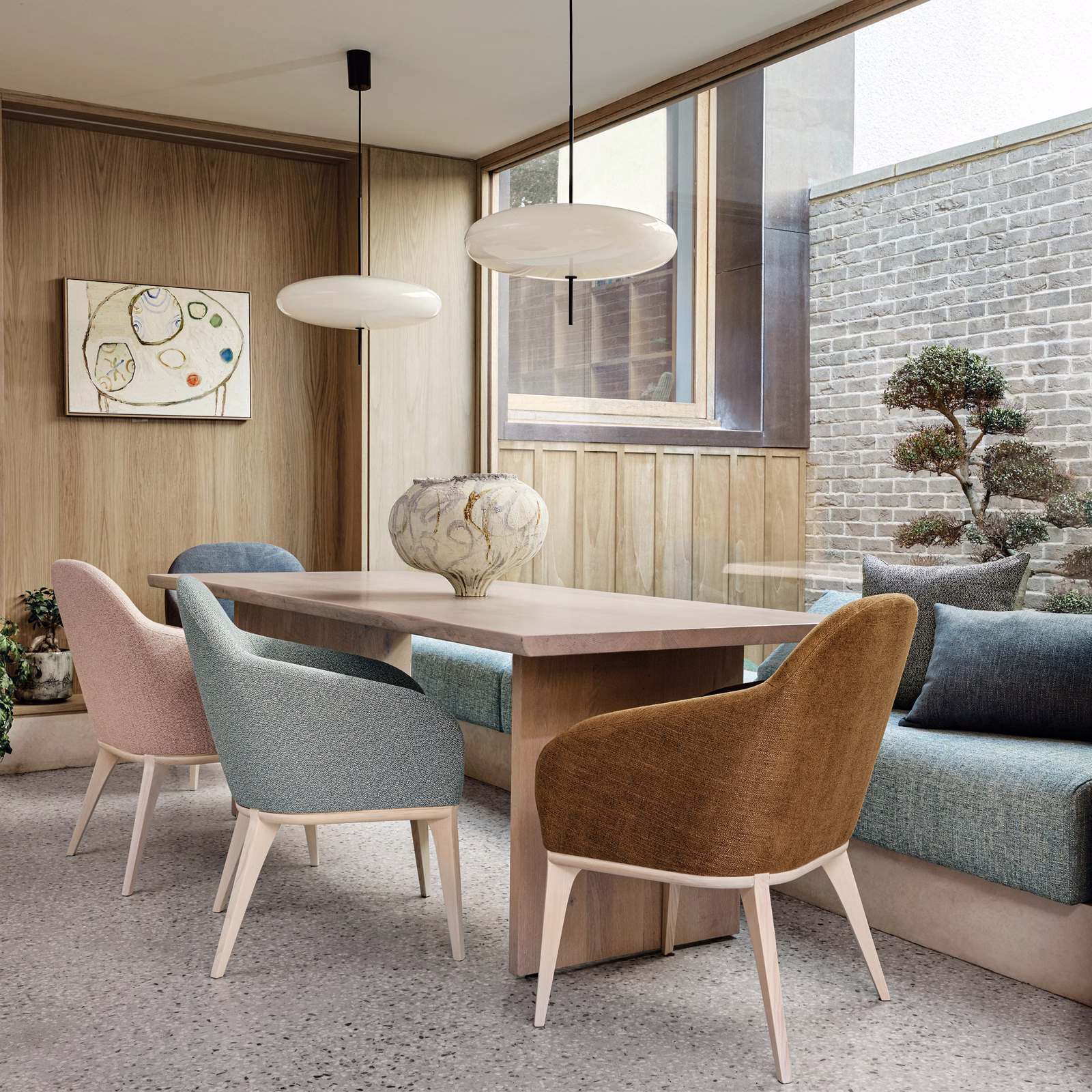 Cool battleship blue-grey textured upholstery on dining chairs and sofa