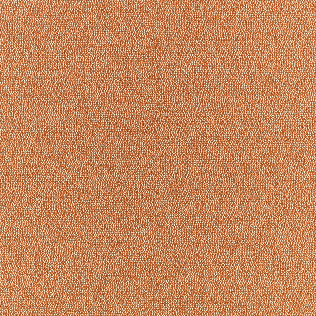 Close-up of warm terracotta woven fabric with fine irregular flecks and tactile texture