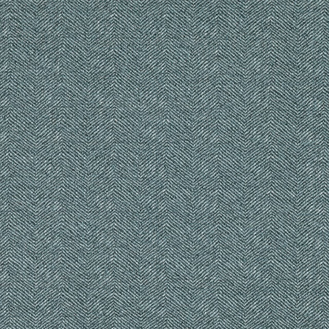 Close-up of muted blue-grey teal fabric with a fine woven herringbone texture