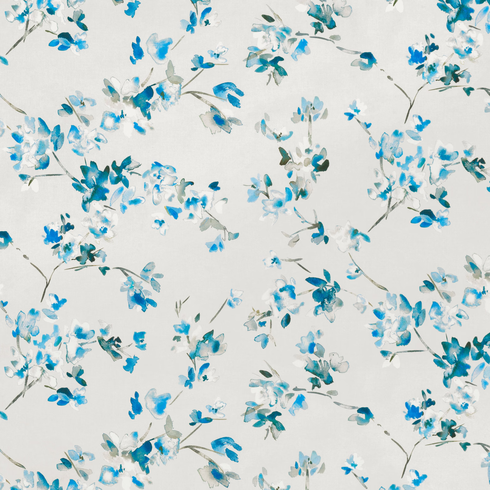 Watercolour-style cobalt and turquoise blossoms scattered over an ivory fabric ground