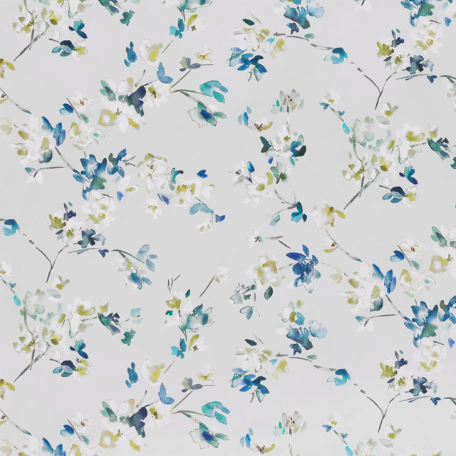 Pale grey floral fabric with blue, teal, green and yellow painted blossoms