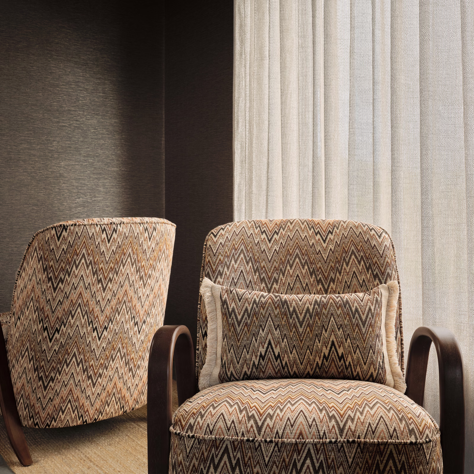 Warm taupe and black zigzag upholstery textile with cream and rust accents
