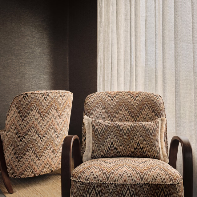 Warm taupe and black zigzag upholstery textile with cream and rust accents