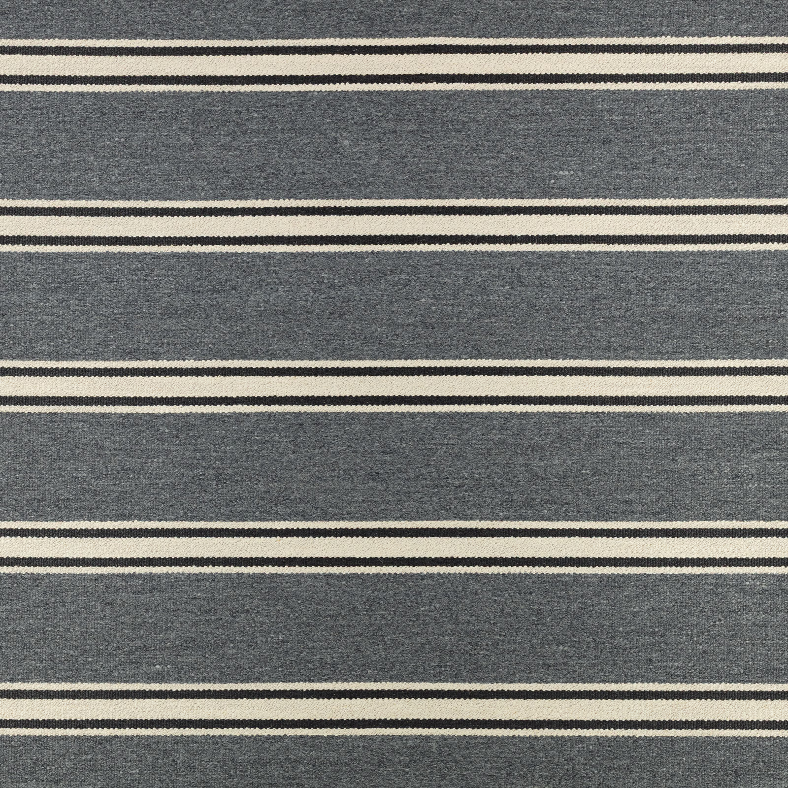 Blue-grey woven upholstery with broad horizontal bands and narrow cream stripes