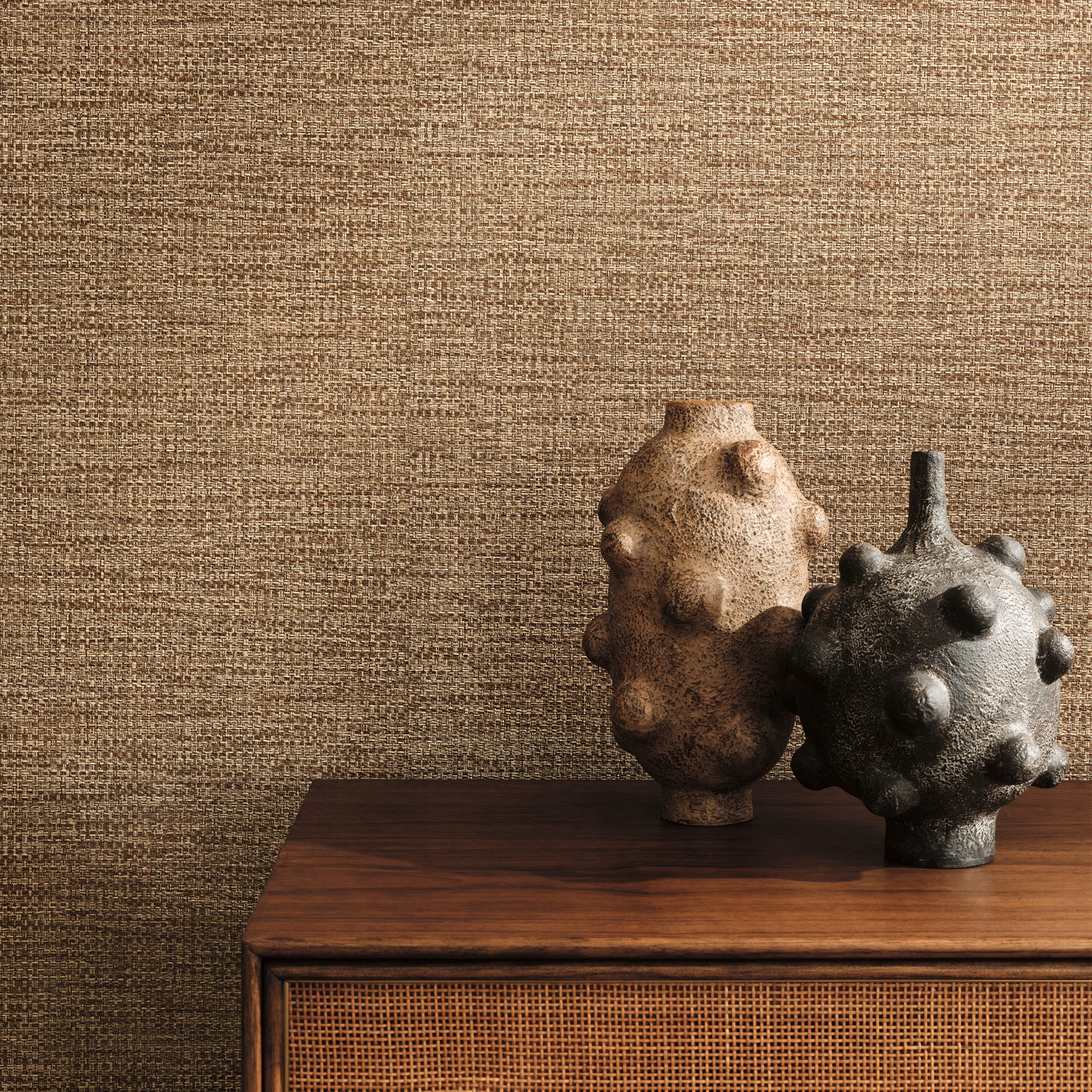 Warm cinnamon-brown woven-look wallpaper with fine horizontal texture beside dark ceramic vessels