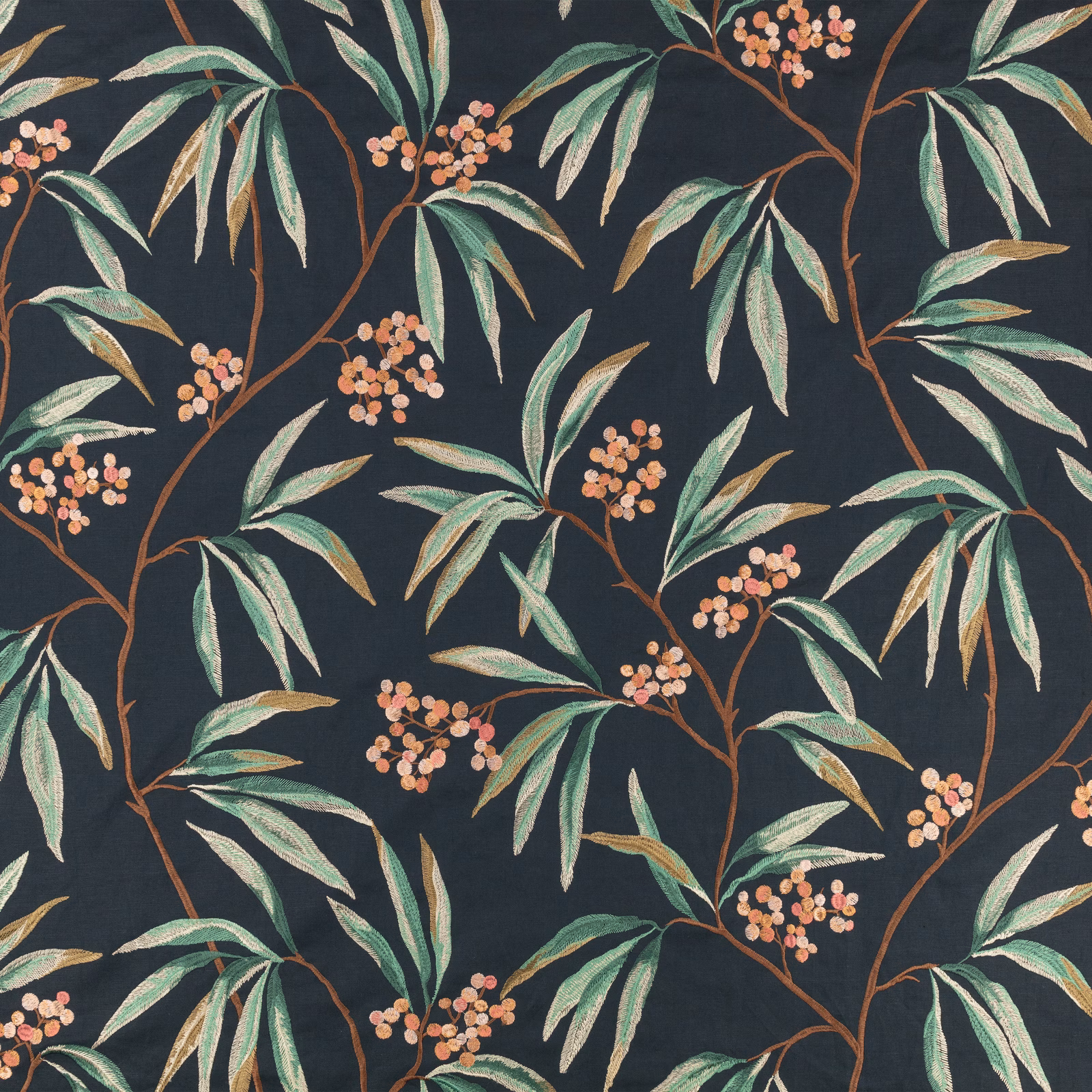 Charcoal-blue botanical fabric with sage leaves and peach blossom clusters