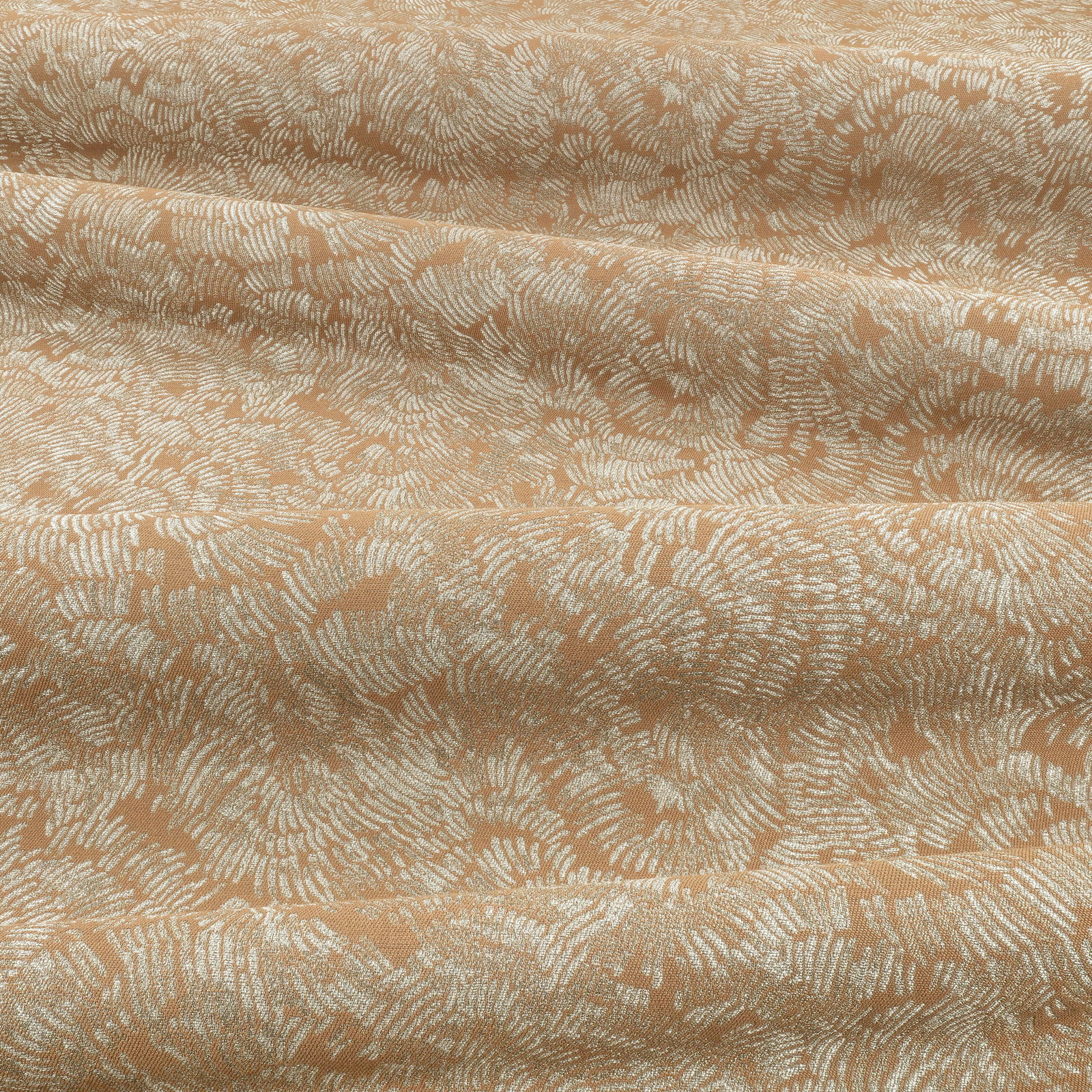 Folded copper fabric with pale ivory branching woven motifs and textured surface