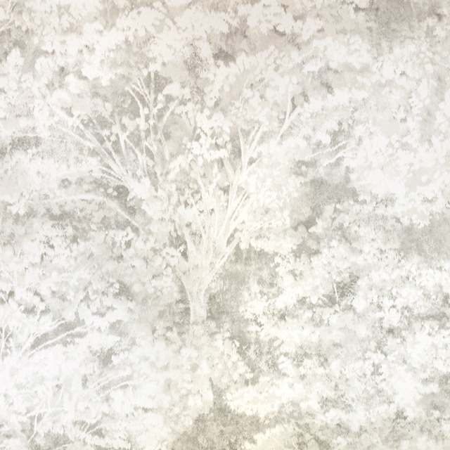 Pale quartz-grey wallpaper with a misted tree and layered leafy botanical motif