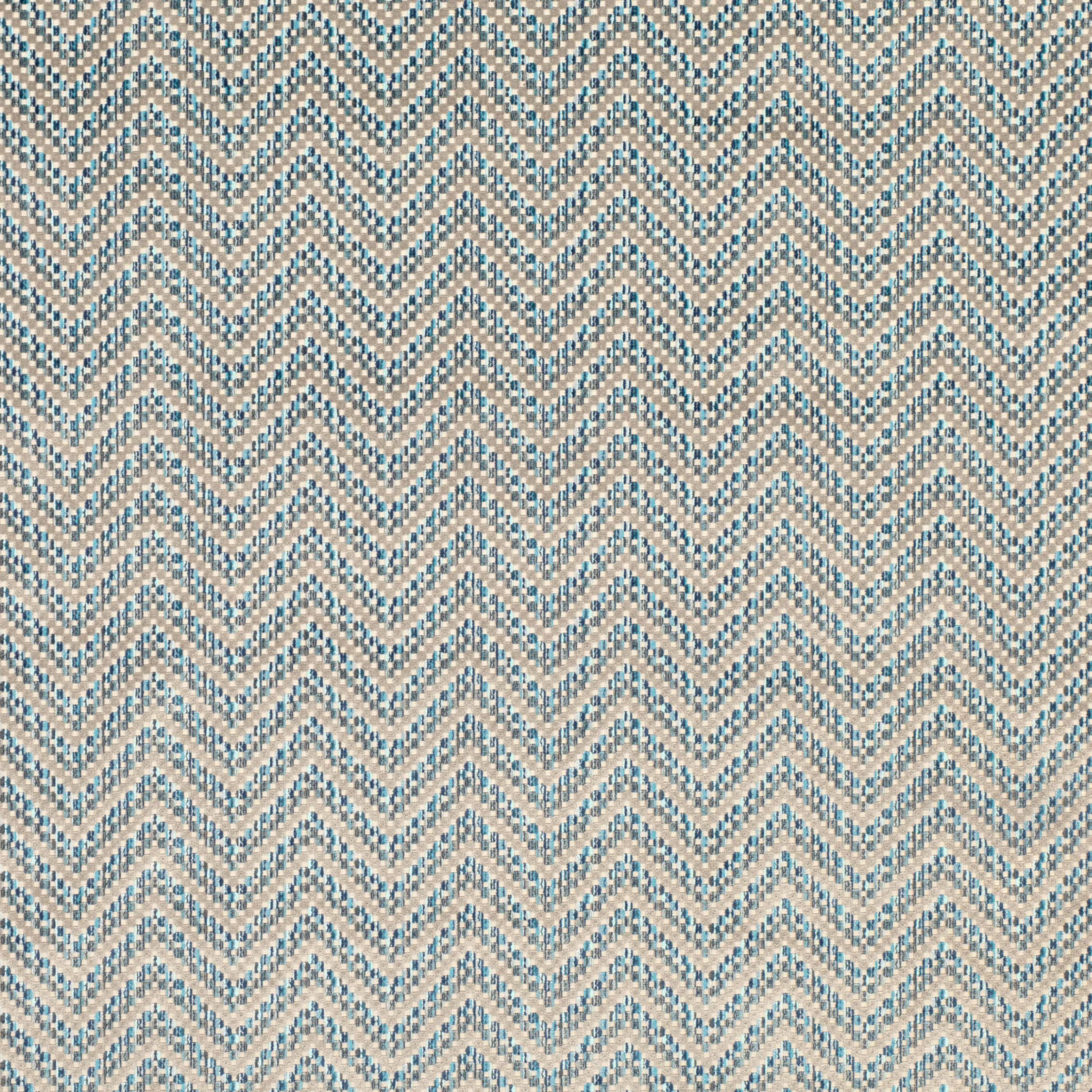 Muted Moroccan blue and sandy beige woven chevron fabric with tactile geometric texture