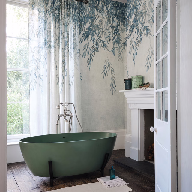 Cream drapery with trailing misty blue-grey botanical sprigs in soft folds