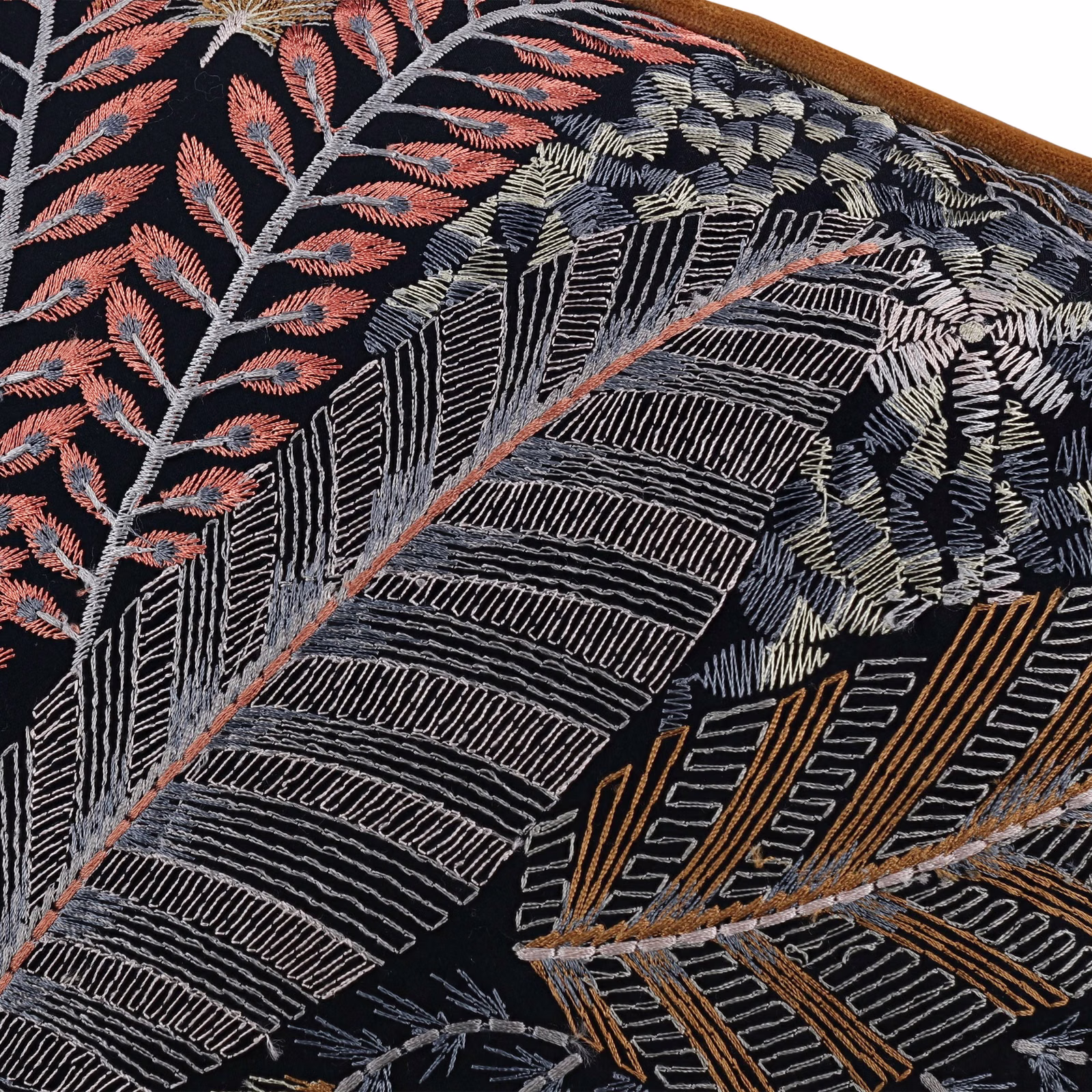 Near-black botanical fabric with coral, ivory and ochre embroidered leaves