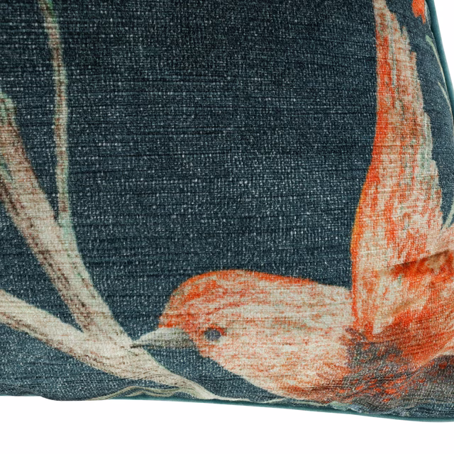 Dark teal velvet cushion with coral and ivory sweeping plume-like forms