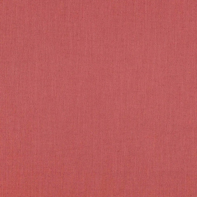 Close-up of muted coral-red Ruskin fabric with a fine, subtly vertical plain weave
